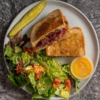 Pastrami & Swiss · Boar’s Head pastrami, Swiss cheese, yellow mustard on Rye.

Served with French Fries, Salad,...