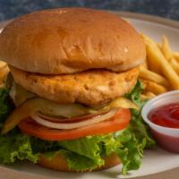 Salmon Burger · Quarter pound beef patty. lettuce, tomato, onion, pickles, 1000 island dressing on toasted d...