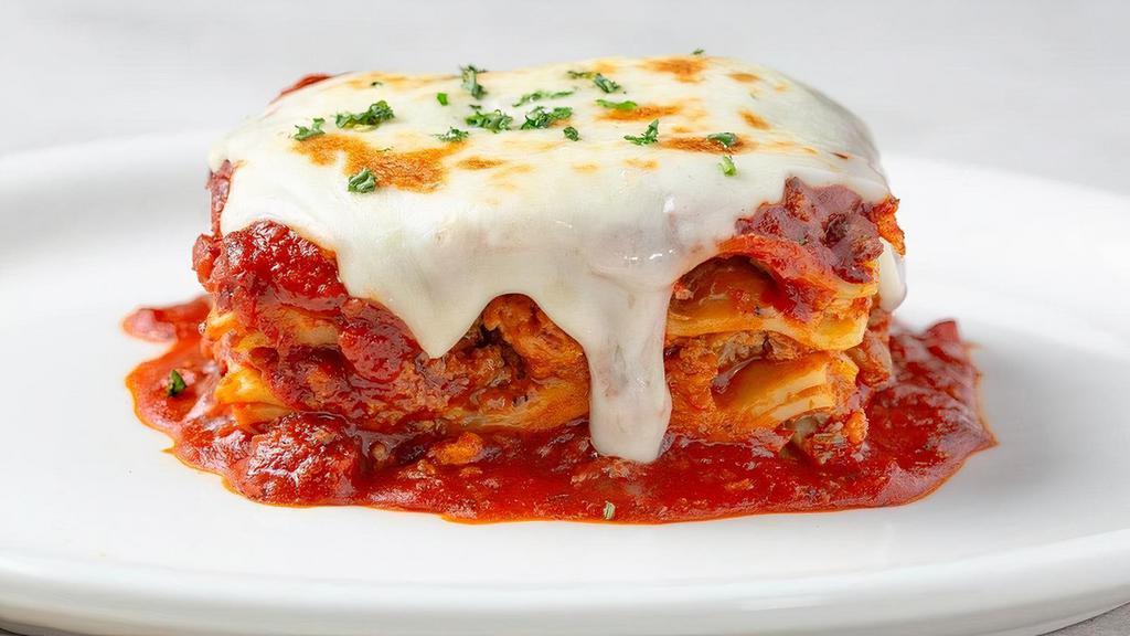 Johnny'S Fresh Baked Lasagna · Layers of pasta, Italian sausage, beef, meat sauce, ricotta, Mozzarella and Parmesan...while supplies last.