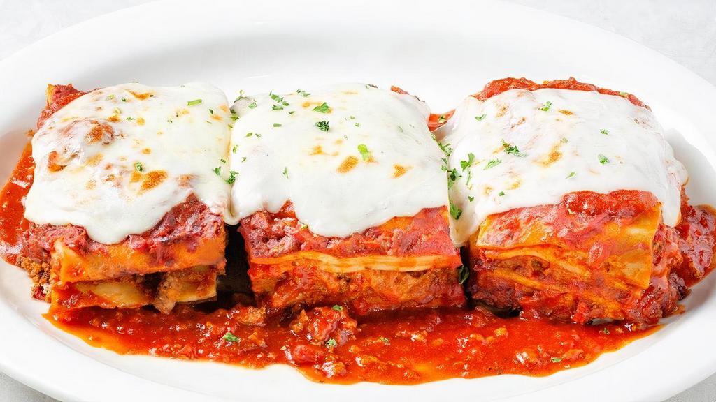 Johnny'S Fresh Baked Lasagna Family Platter · Layers of pasta, Italian sausage, beef, meat sauce, ricotta, Mozzarella and Parmesan...while supplies last.