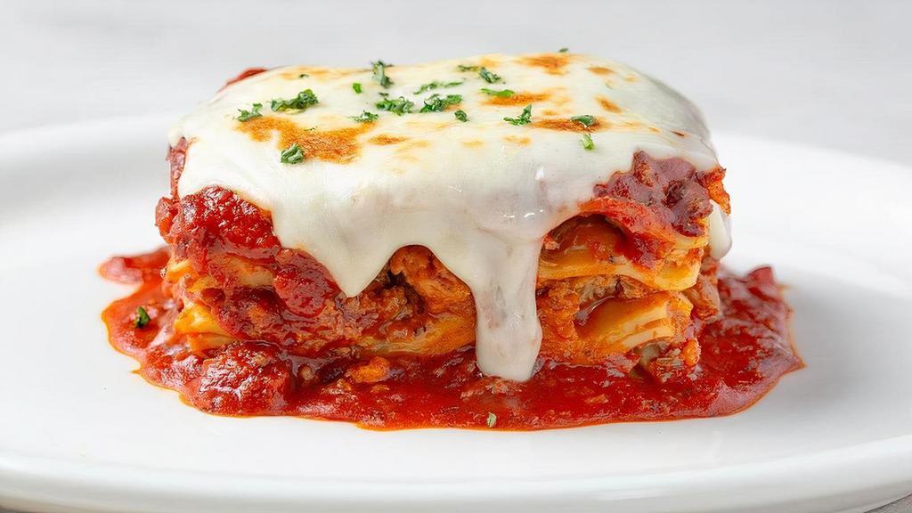 Johnny'S Fresh Baked Lasagna · Layers of pasta, Italian sausage, beef, meat sauce, ricotta, Mozzarella and Parmesan...while supplies last.