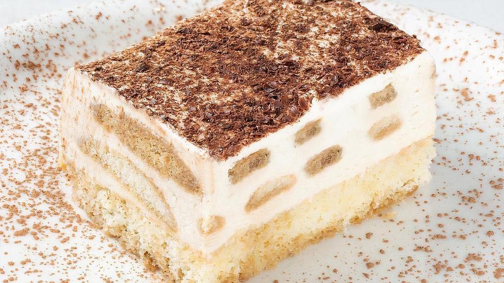 Tiramisu · Ladyfinger cookies soaked in coffee and layered between a sweet Italian custard blended with rum and coffee liqueur.