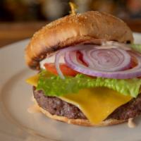 Cheddar Burger · Angus patty, sharp cheddar, tomato, onion, lettuce, thousand island, and kaiser roll.
