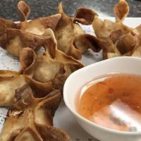 Crab Rangoon · Seven pieces. Fried wonton pasty stuffed with crabmeat and cream cheese served with sweet pl...