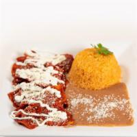 Chilaquiles · Corn tortillas fried over red or green sauce with a side of rice and beans.