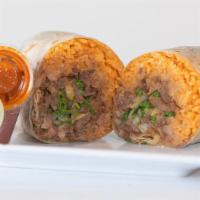 Burrito · Flour tortilla, rice, beans , choice of meat and onions and cilantro.