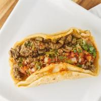 Soft Taco · (Carne asada, pollo asado, carnitas, lengua, or birria;) served on two fresh corn tortillas ...