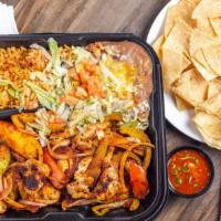 Fajitas (Chicken) · Tender strips of  chicken are grilled with fresh bell peppers, onions and tomatoes.