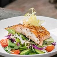 Salmon Salad · Signature local mixed greens, cherry tomatoes, red onion, Persian cucumbers, cabbage and bal...