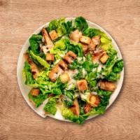 Classic Caesar Salad · Crisp, delicious romaine lettuce topped with green leaf lettuce, croutons, parmesan cheese, ...