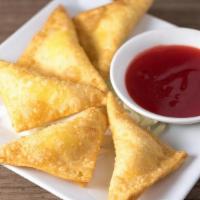 Crab 'N Cream Cheese Wontons · Served with house-made Sweet 'n Sour sauce.  6 pieces.