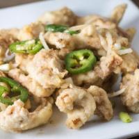 Salt 'N Pepper Chicken · Lightly battered and deep fried, then wok-baked with jalapenos and onions in a special blend...
