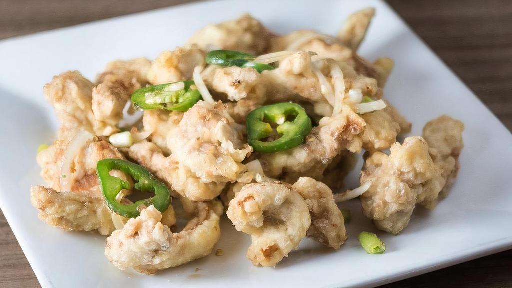 Salt 'N Pepper Chicken · Lightly battered and deep fried, then wok-baked with jalapenos and onions in a special blend of salt and pepper spices.
