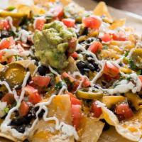 Nachos · Choice of beans, cheese, pico de gallo, jalapenos, sour cream, guacamole