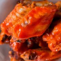 10 Jumbo Wings · Our Jumbo sized seasoned chicken wings are fried the tossed in your choice of sauce