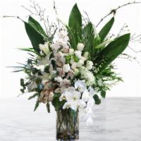 Glorious · A glorious arrangement of white orchids, roses, lilies, and leafy greens

Our delivery servi...