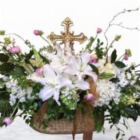 Spiritual Serenity · A Golden Cross is the centerpiece of this lush arrangement.  Filled with hydrangea, stock, r...