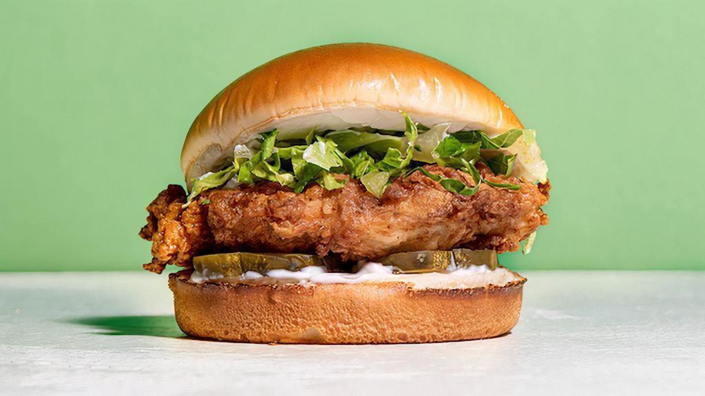 The Other Side Signature Crispy Chicken Sandwich · Cornflake Crusted Chicken Breast seasoned in our signature spice blend in between a toasted brioche bun with pickles, mayo, romaine lettuce.