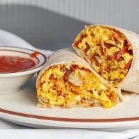 Siggys Breakfast Burrito · 3 eggs, hash browns, salsa with ham, bacon or sausage.