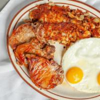 Pork Chops And Eggs Breakfast · Served with 2 eggs any style, hash browns, toast and jelly.