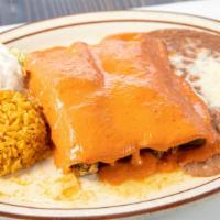 Enchiladas De Chipotle · Two chicken enchiladas topped with our delicious chipotle sauce, and cheese, served with ric...