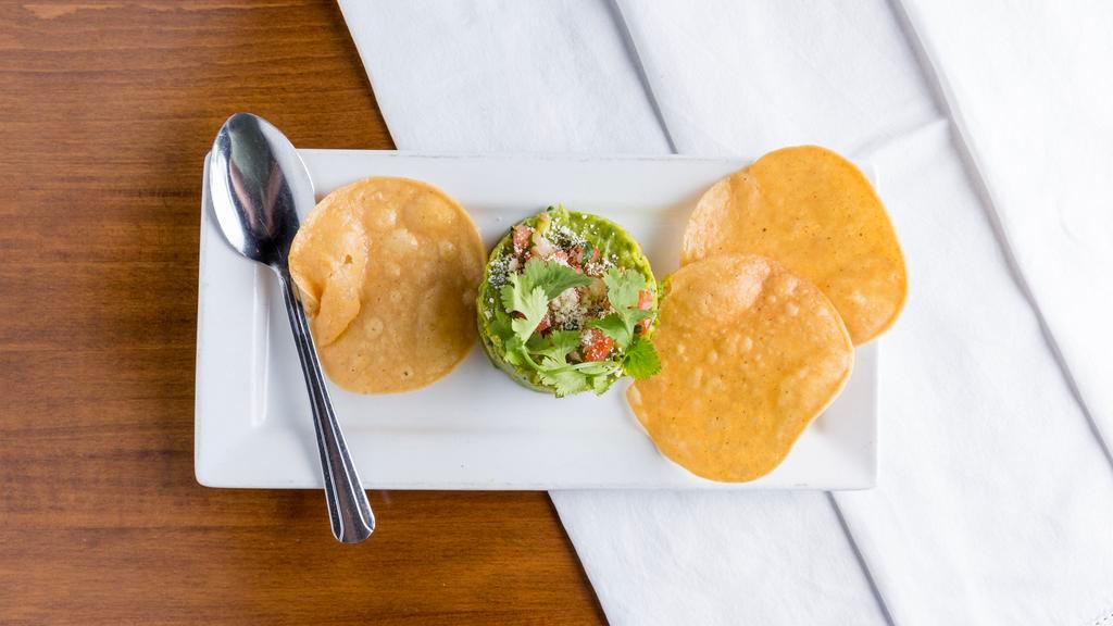 Guacamole De Mexico · Hass avocado, cilantro, serrano chilies, tomatoes, diced onions and fresh lime juice. Served with tostaditas.
