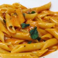 Penne Alla Vodka · PENNE WITH CREAMY PINK VODKA SAUCE , BACON, SHALLOTS