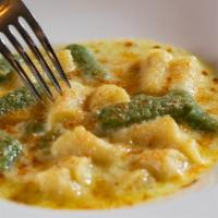 Gnocchi Di Patate Radici · HOUSEMADE POTATO & SPINACH DUMPLING, STILTON CREAM SAUCE AL GRATIN