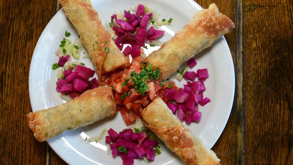 Rekakat · Feta and mozzarella cheese puffs, onions, parsley, and sesame seeds.