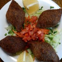 Kibbeh Appetizers · Mix beef and cracked wheat shell shell stuffed seasoned ground beef onion and pine nuts