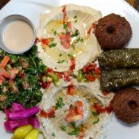 Combo Veggie Plate · Falafel, hummus, baba ghannoush, tabouleh, two grape leaves, tahini. Rice and salad not incl...
