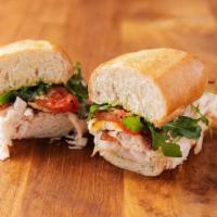 Roasted Turkey Club · All natural, hand carved roasted turkey breast topped with hardwood smoked bacon, slow-roast...