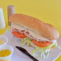 Turkey And Cheese Sub  · Comes with lettuce, tomato, onion, provolone cheese, our famous Submarine Dressing, mayonnai...