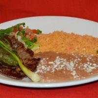 Carne Asada Platillo · Grilled steak Mexican style.