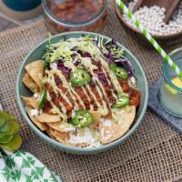 Amazing Vegan Nachos · vegan chili, vegan white cheddar, green onion, cabbage, tofu ‘sourcream' + jalapeno