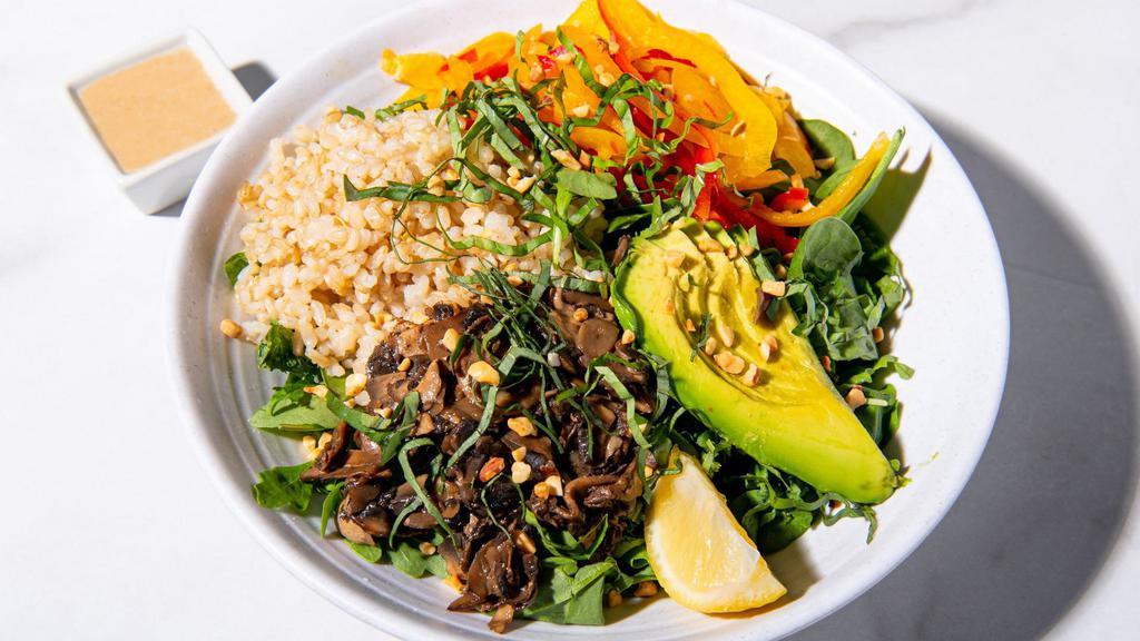 Thai Peanut Salad · Mixed greens,sauteed mushrooms, peppers, basil,roasted peanuts, sesame seeds, peanut dressing, lemon wedge. Served with a base of your choice and either roasted antibiotic-free chicken or roasted sesame tofu. (Gluten-Free & Vegan)