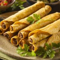 2 Beef Taquitos · 2 beef taquitos served with lettuce and guacamole.