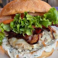 Turkey Bacon Ranch Burger · Turkey patty, applewood-smoked bacon, cheddar cheese, lettuce, tomato, & ranch dressing on a...