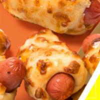 Cheesy Dog Bites · When you're feeling cheesy and snacky. Dog Bites baked with our three-cheese blend for a cri...