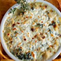 Spinach & Artichoke Dip · Baby spinach & chopped artichokes simmered with garlic, herbs & 5 creamy cheeses. Hand-cut Y...