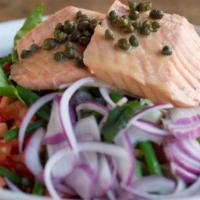 Poached Salmon Niçoise · Chilled poached salmon atop organic mixed greens with haricot vert, red potatoes, red onions...