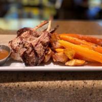 Signature Lamb Chops · Three thick cut lamb chops marinated in Demi-glace, with roasted potatoes and glazed carrots.