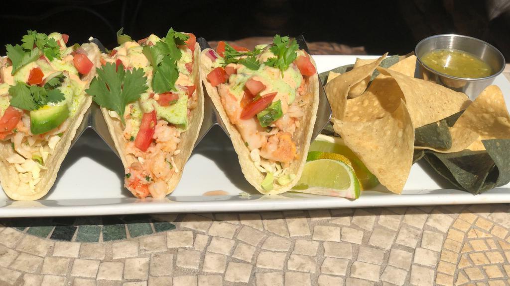 Chipotle Lime Lobster Tacos · Marinated Lobster, avocado, cilantro lime sauce, chipotle aioli, scallions & pico de gallo. Served on corn tortillas with house-made salsa & tortilla chips.