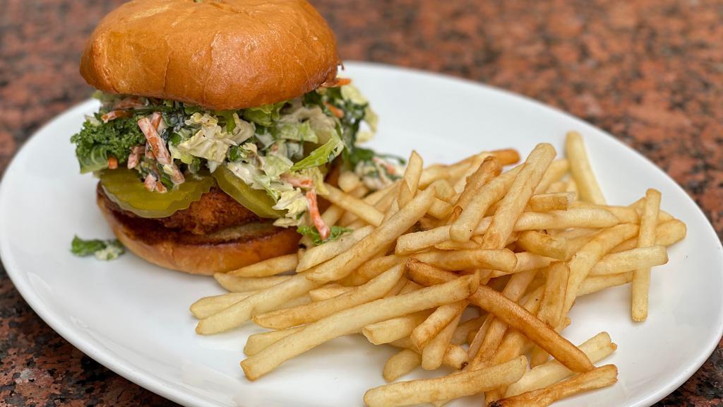 Nashville Hot Chicken Sandwich · Free-range ABF fried chicken breast soaked in Nashville hot sauce, with coleslaw, pickles, and jalapeño ranch. Served with your choice of french fries or salad.