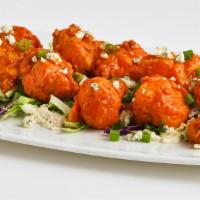 Buffalo Cauliflower · Lightly battered and fried cauliflower florets tossed in our buffalo sauce on a bed of bleu ...