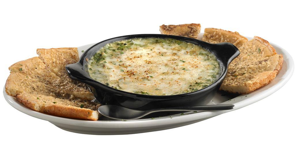 Spinach & Artichoke Dip · A made from scratch blend of creamy Alfredo sauce, fresh spinach, artichoke hearts, and a mix of cheeses. Served with handmade bread. Serves 3-4 people