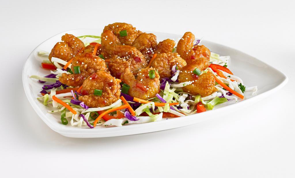 Thai Shrimp Bites · Breaded and fried shrimp tossed in an Asian glaze and served on shredded cabbage. Topped with carrots, green onions, and sesame seeds. (660 Cal)