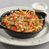 Loaded Cheese Fries · Fries smothered in our rich queso topped with fresh jalapeños, diced tomatoes, and bacon. Ga...