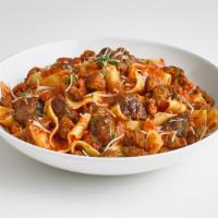 Hungry Carnivore Pasta · Italian sausage, diced meatballs, bacon, pepperoni, and penne pasta smothered in Bolognese s...
