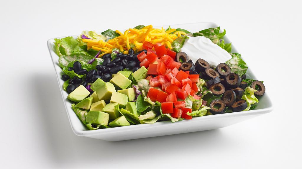 Santa Fe · Fresh mixed greens tossed with our Santa Fe ranch dressing. Topped with black beans, cherry tomatoes, cheddar cheese, black olives, sour cream, avocado, and tortilla strips.